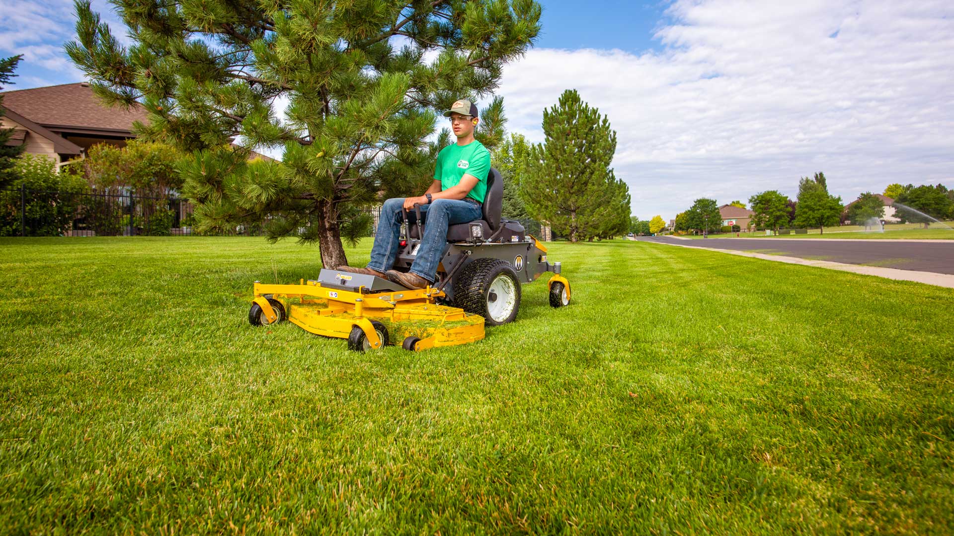 Image of a Walker R22x Mower with an S54 Side Discharge Deck Mowing a Lawn