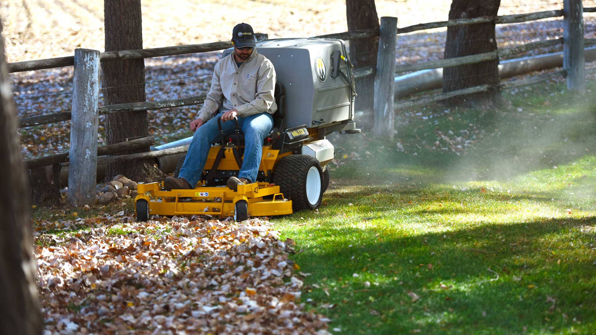 Image of a Walker T25i Mower Mulching Fall Leaves
