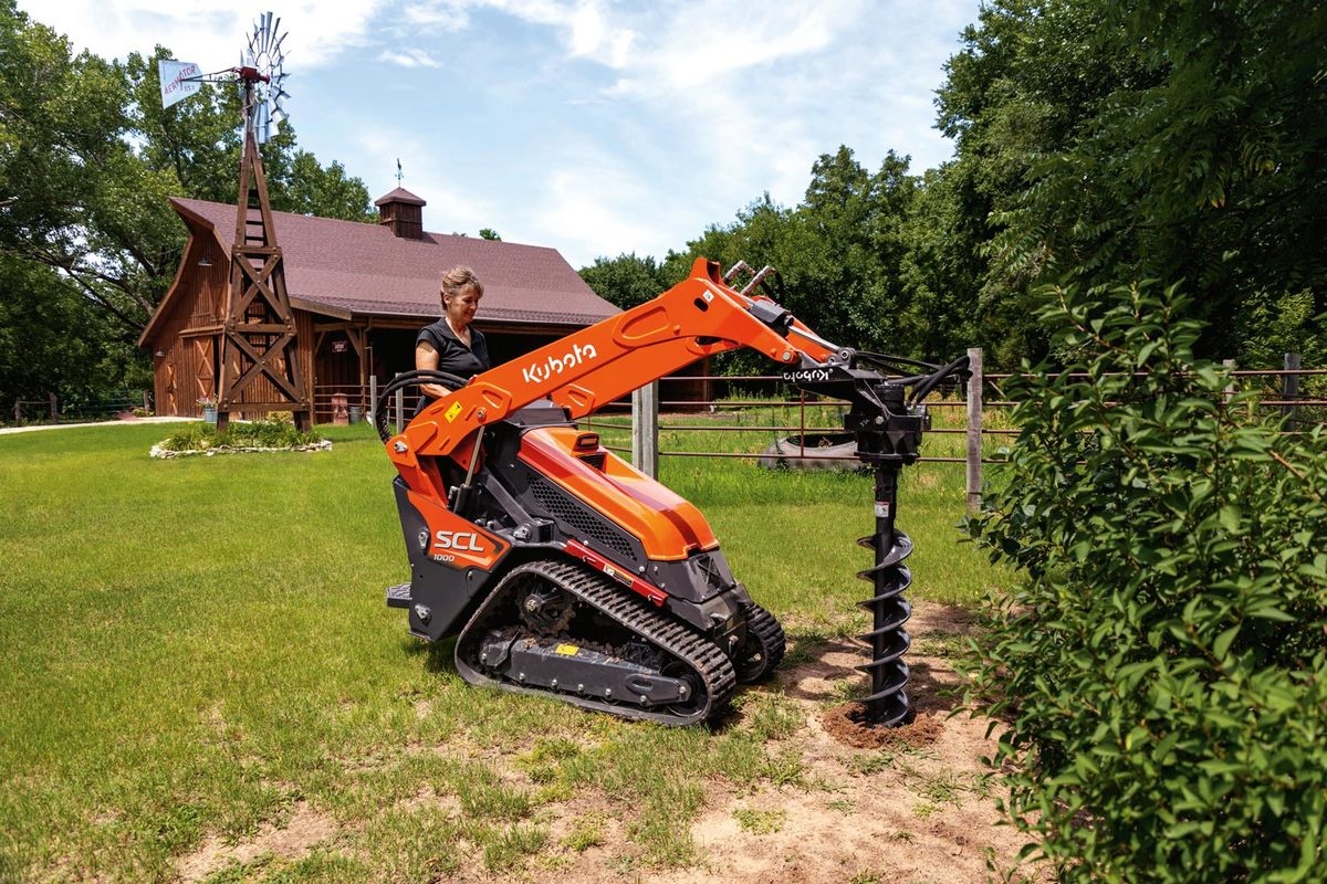 Kubota SCL1000 with Post Hole Digger